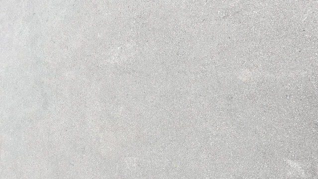 Light gray asphalt surface with fine grain and smooth even texture. A clean, uniform finish with minimal variation across the frame. Ideal for road, urban, or neutral design backgrounds.