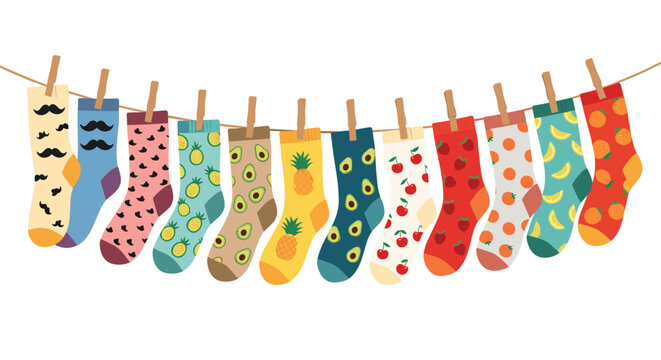 Variety of colorful patterned socks including fruit and mustache designs hang from a clothesline with wooden pins.