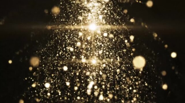 Abstract golden particles fall from a bright light source on a black background creating a shimmering effect