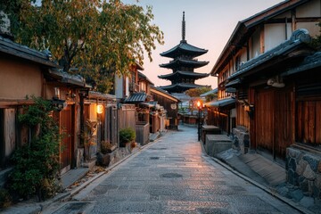 Obraz premium Traditional Japanese street scene with wooden houses and a pagoda at dusk, illuminated lanterns lining the cobblestone path in a historic district