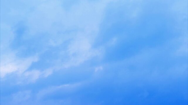 Beautiful white clouds moving shining through fog in blue sky, white clouds 4K stock footage. flight over the clouds with strong wind amazing cloudscape. 