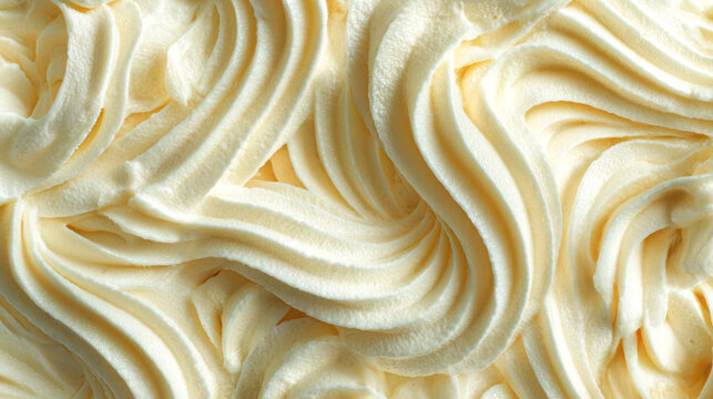 Intricate pale yellow swirled icing texture close-up frosting cream