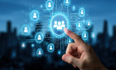 Fototapeta premium Connecting people in a digital network with one hand on the screen at dusk