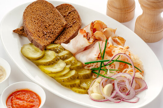 Classic appetizer platter with salo pickles and rye bread