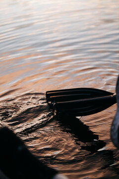 Kayak Paddle Splashing Sunset Golden Water