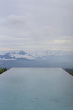 Serene infinity pool overlooking misty mountains, Munduk, Bali