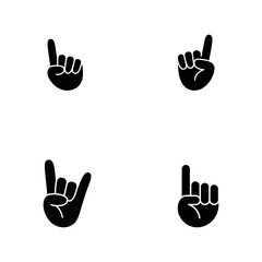 Fototapeta premium Four black silhouette of human hands showing different gestures including pointing up and the rock and roll sign on a white background