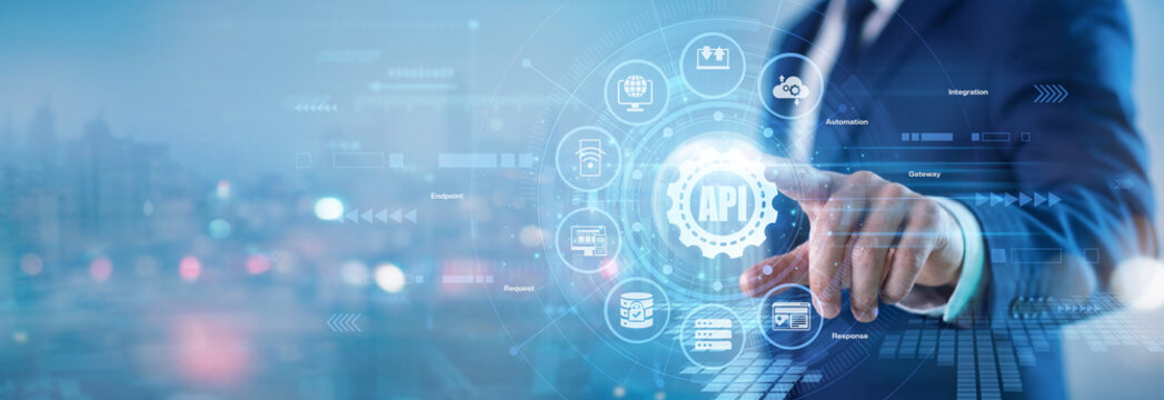 Software engineer. Senior technology developer touching API virtual screen to integrate external software applications and optimize modern cloud communications. Seamless system connectivity.