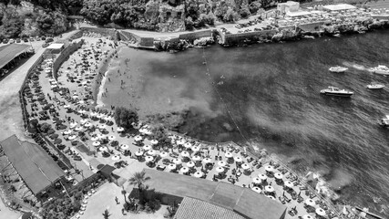 Fototapeta premium Aerial view of Marina di Puolo coastline and seaside bay in