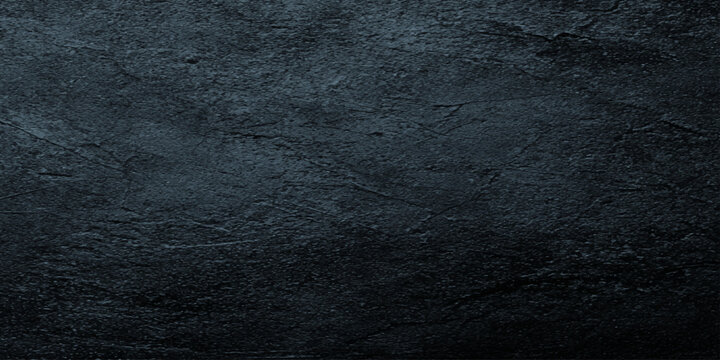 Dark textured slate background with rough stone surface and subtle blue undertones for design and decoration