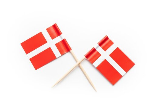 Two small toothpick flags of denmark isolated on white background