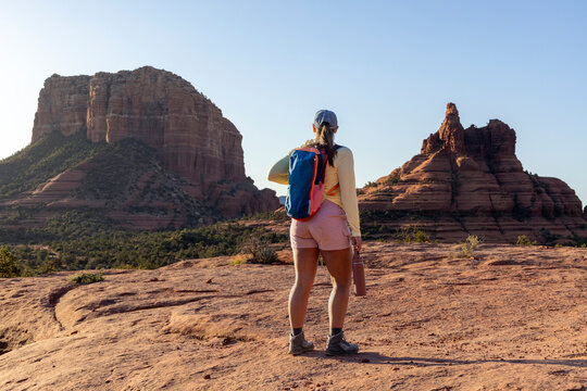 WOman hiker in rocky alien wilderness looking away