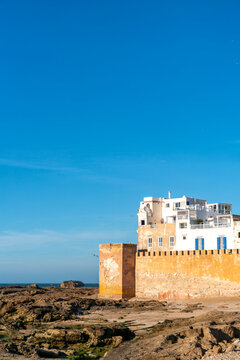Coastal ramparts of Essaouira against a blue sky in Morocco