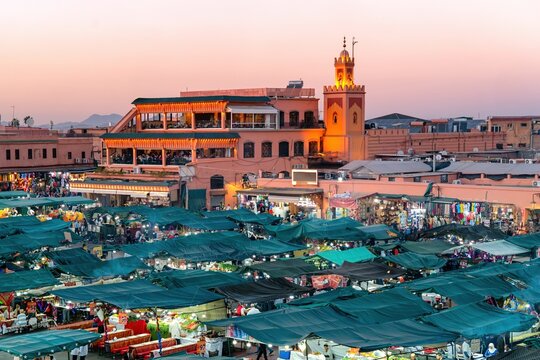 Sunset view over bustling Jemaa el Fna square in Marrakesh, Morocco