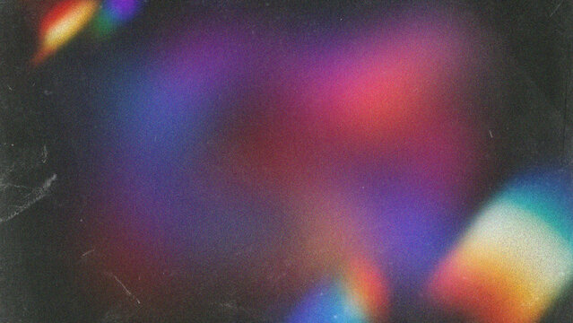 Abstract colorful light leaks with dark grain texture overlay