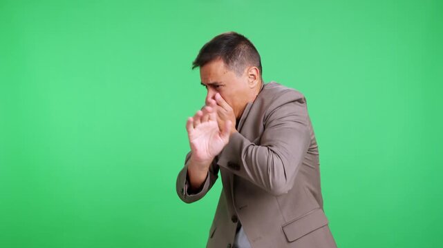 Embarrassed businessman regretting a mistake on green screen