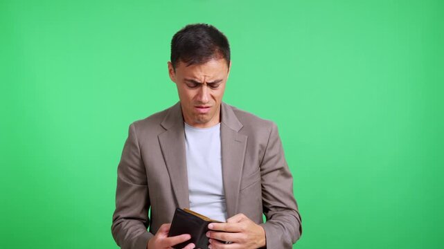 Disappointed broke man showing his empty wallet