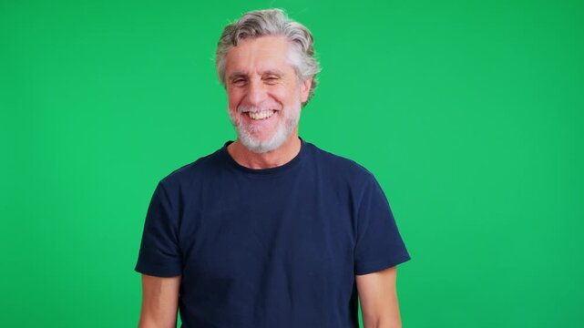 Mature man laughing genuinely in a studio