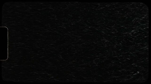 Abstract black film scratch texture loop with subtle grain and distressed motion, cinematic 4K background for gritty edits and overlays