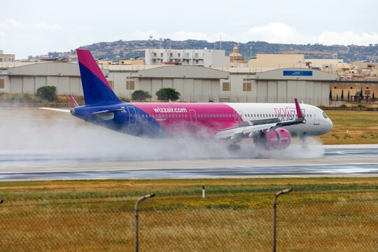 Luqa, Malta - May 17, 2026: Wizz Air Airbus A321-271NX (Reg.: HA-LDL) one of the new NEO A321 with Wizz braking on a wet runway.
