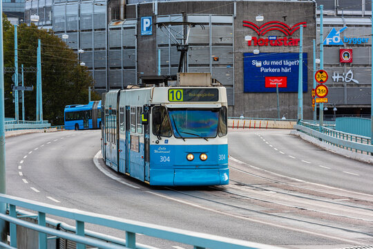 Gothenburg, Sweden - september 20 2019: Blue tram traveling on bridge in modern city environment.