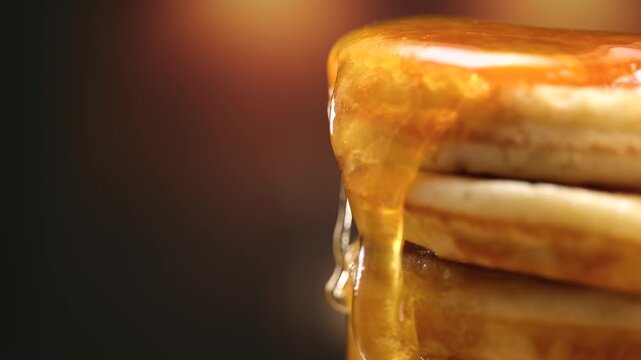 Pancakes stack with dripping honey syrup