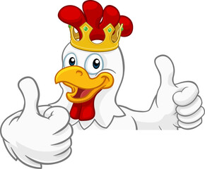 A chicken rooster cockerel bird cartoon character in a gold kings crown peeking over a sign and giving a double thumbs up © Christos Georghiou