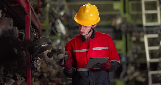 Warehouse Technician Auditing Auto Parts Inventory