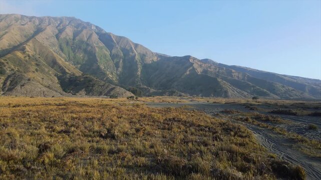 Amazing 4K view of Mount Bromo savanna valley with off-road tracks in East Java, Indonesia.
