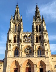 Fototapeta premium Cathedral architecture against a clear blue sky gothic spires and facade