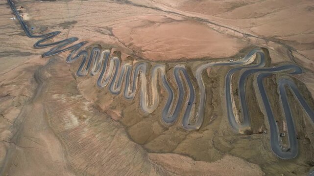 Winding Desert Mountain Road Through Arid Landscape