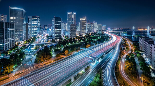 湾岸エリアのビル群と高速道路の光跡が描く未来的な夜景