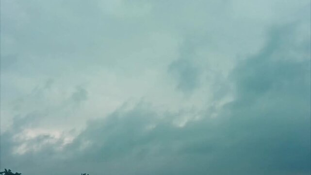 Beautiful white clouds moving shining through fog in blue sky, white clouds 4K stock footage. flight over the clouds with strong wind amazing cloudscape. 