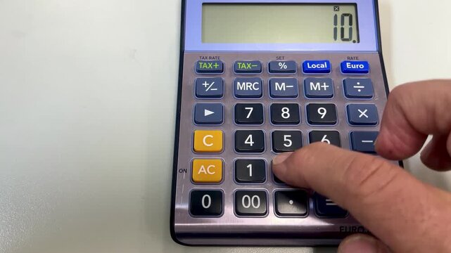 hand pressing buttons on a purple and silver electronic calculator to perform various mathematical operations for business accounting and financial planning, 4k