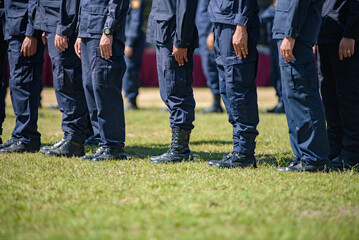 Fototapeta premium Riot police control the crowd practice and review on the grass field.