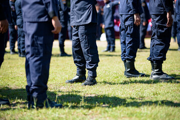 Fototapeta premium Riot police control the crowd practice and review on the grass field.