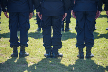 Fototapeta premium Riot police control the crowd practice and review on the grass field.