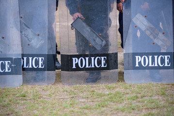 Fototapeta premium Riot police control the crowd practice and review on the grass field.