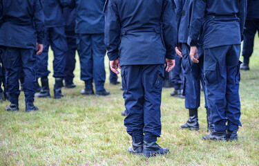 Fototapeta premium Riot police control the crowd practice and review on the grass field.