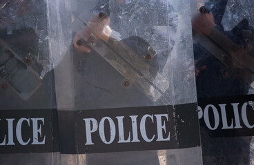 Fototapeta premium Riot police control the crowd practice and review on the grass field.