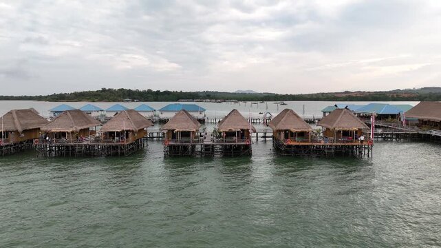 Aerial View of Waterfront Huts in Batam, Indonesia - 4K Stock Footage