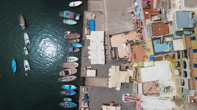 Panoramic drone shot of Procida old town coastline in