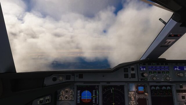 Cockpit View of Airplane Flying Through Clouds and Blue Sky on a Sunny Day.