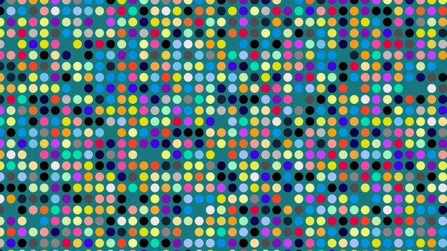 Colorful polka dot pattern on teal background in photo