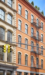 Obraz premium Old building with iron fire escape, New York City, USA.