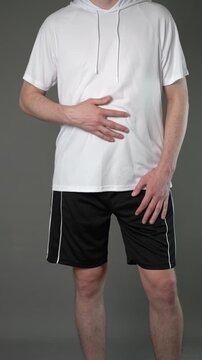 Stomach ulcer, man with abdominal pain suffering on gray background