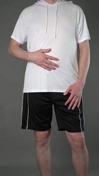Stomach ulcer, man with abdominal pain suffering on gray background