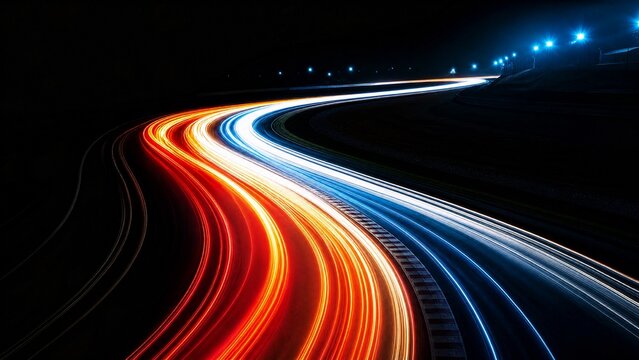 longexposure. Long exposure of race track lights creating smooth, flowing color bands on dark background. mobility guides, transit brochures, designed for mobility and urban transit guides.