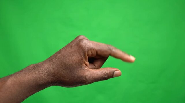 Hand gesture for 'small' or 'little' on a green screen