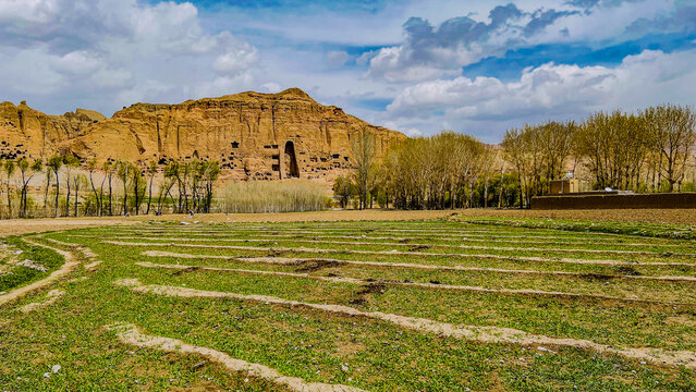 Historic Bamiyan Buddha cliffs in central Afghanistan, featuring ancient caves, dramatic mountain landscapes, and the cultural heritage of the historic Silk Road region.